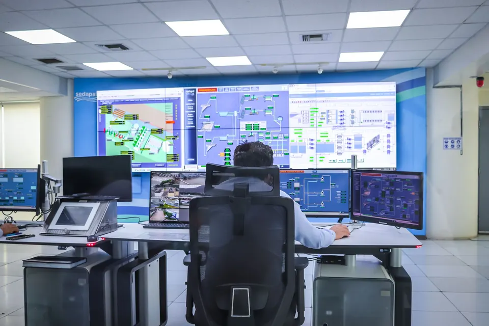 Operator in a control room with supervisory displays