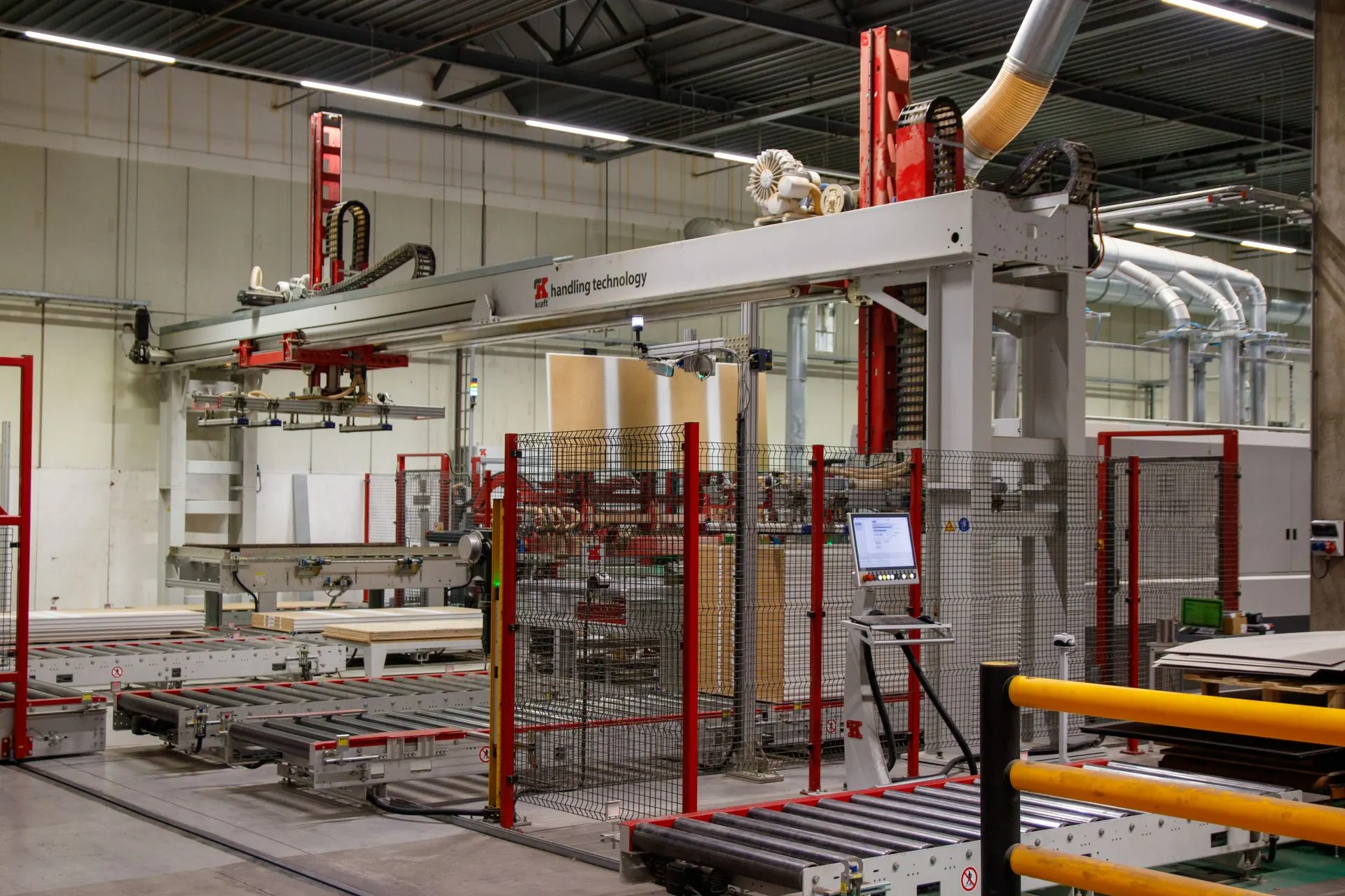 Gantry and robotic arm in a manufacturing facility